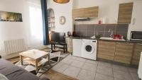 a kitchen and living room with a washing machine at Residence Pasteur Angouleme in Angoulême