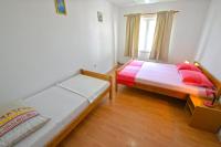 Postel nebo postele na pokoji v ubytování Apartments Goranka