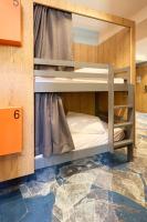 a bunk bed room with two bunk beds in it at Hotel Base Camp Lodge - Albertville in Albertville