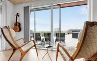 Balkón nebo terasa v ubytování Four-Bedroom Holiday Home In Knebel