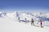 a group of people walking up a snow covered mountain at Hôtel Club mmv Le Flaine *** in Flaine