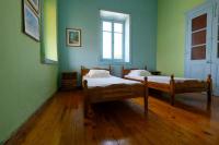 A bed or beds in a room at Archontiko Pataka
