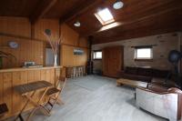 a living room with a couch and a table at The Wild Seeds in Chauvigny