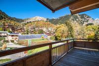 a balcony with a view of the mountains at Résidence LES TERRASSES DE LA VANOISE - Appartement LES TERRASSES DE LA VAN 924 in Champagny-en-Vanoise