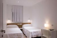 Postel nebo postele na pokoji v ubytování Hostal Nova Barcelona