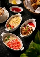 a group of bowls of food on a table at Governor's Residence in Yangon