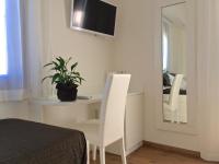 Televízia a/alebo spoločenská miestnosť v ubytovaní Boutique Hotel e Spa Città Bianca