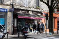 a group of people walking in front of a store at We Love Paris - Private Apartment in Vitry-sur-Seine