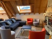 a living room with a blue couch and chairs at Chalet Valloire, 6 pièces, 12 personnes - FR-1-263-156 in Valloire