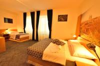 Postel nebo postele na pokoji v ubytování Hotel Orient Zagreb