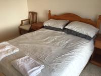 a bed with two pillows on it in a bedroom at Captivating 8-Bed House in Porthleven in Porthleven