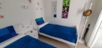 A bed or beds in a room at Las Golondrinas - RISSAGA