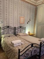 A bed or beds in a room at La Casa sul Lungarno