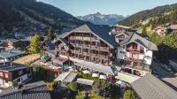 an aerial view of a hotel in the mountains at Hôtel Alpina &amp; SPA in Les Gets