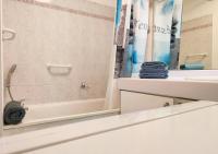 a bathroom with a shower and a sink and a mirror at Le Victoria-Centre ville-Piscine-Parking privé-Wi-Fi in Hyères