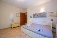 Łóżko lub łóżka w pokoju w obiekcie Villa La Dolce Vita - Happy Rentals