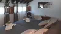 A bed or beds in a room at Molino Los Justos - Casa Vieja- Algarinejo by Ruralidays