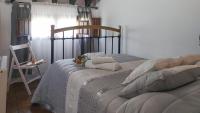 A bed or beds in a room at Molino Los Justos - Casa Vieja- Algarinejo by Ruralidays