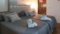 A bed or beds in a room at Molino Los Justos - Casa Vieja- Algarinejo by Ruralidays