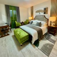 a bedroom with a bed and a desk and a piano at Guesthouse Villa Vice in Split