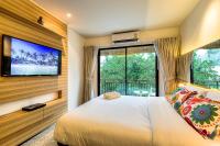 Postel nebo postele na pokoji v ubytování The Title Boutique Phuket