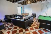 a living room with couches and a pool table at Crazy Villa Champs Corons 61 - Interior heated pool - 2h from Paris - 30p in Les Menus