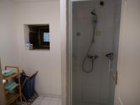 a bathroom with a shower with a glass door at Gîte de l&#39;Hirondelle bleue in Brech