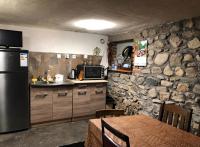Kuchyň nebo kuchyňský kout v ubytování Alpin Guest House