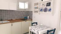 A kitchen or kitchenette at La Piazzetta