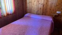 Postel nebo postele na pokoji v ubytování Camping de Cervera de Buitrago