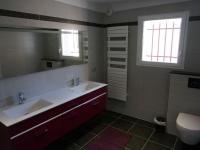 a bathroom with a sink and a mirror and a toilet at Magnificent Villa in Saint Ambroix with Private Pool in Saint-Ambroix