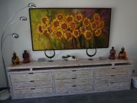 a painting of flowers on top of a dresser at Magnificent Villa in Saint Ambroix with Private Pool in Saint-Ambroix