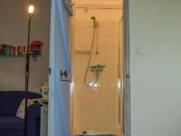 a shower with a glass door in a bathroom at Snug cottage in Saint Eutrope De Born with pool in Saint-Eutrope-de-Born