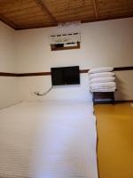 Ein Bett oder Betten in einem Zimmer der Unterkunft Hanok Raon