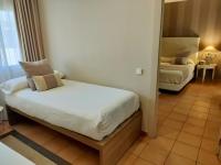 A bed or beds in a room at Alborán Algeciras