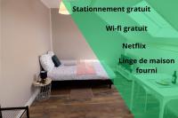 Łóżko lub łóżka w pokoju w obiekcie LD-Location Hôtel