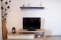 Televízia a/alebo spoločenská miestnosť v ubytovaní Apartment Sol