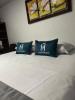 Hotel Boutique Casa Magalyにあるベッド