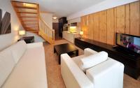 Televízia a/alebo spoločenská miestnosť v ubytovaní Via Jasna Wellness Apartments