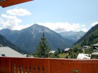 a view of a mountain range from a balcony at Spacious holiday home near center of Champagny in Le Villard