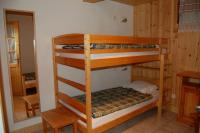 a bedroom with two bunk beds in a room at Spacious holiday home near center of Champagny in Le Villard