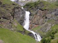 a waterfall on the side of a mountain at Spacious holiday home near center of Champagny in Le Villard