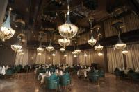 a dining room with tables and chairs and chandeliers at Classic Sapphire Ananta Bundi in Būndi