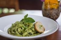 ein weißer Teller mit Pasta und Pesto in der Unterkunft The Alena Resort a Pramana Experience in Ubud