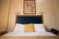 Posteľ alebo postele v izbe v ubytovaní Adams Hotel