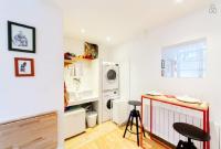 a kitchen with a sink and a washing machine at Incredible location - in the heart of old town in Lyon