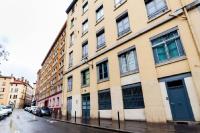 a large building on a city street with cars parked at Incredible location - in the heart of old town in Lyon