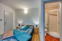 Postel nebo postele na pokoji v ubytování Apartments Suki