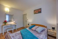 Postel nebo postele na pokoji v ubytování Apartments Suki