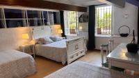 Posteľ alebo postele v izbe v ubytovaní Casa única con jardín a 45 metros de la playa. BE